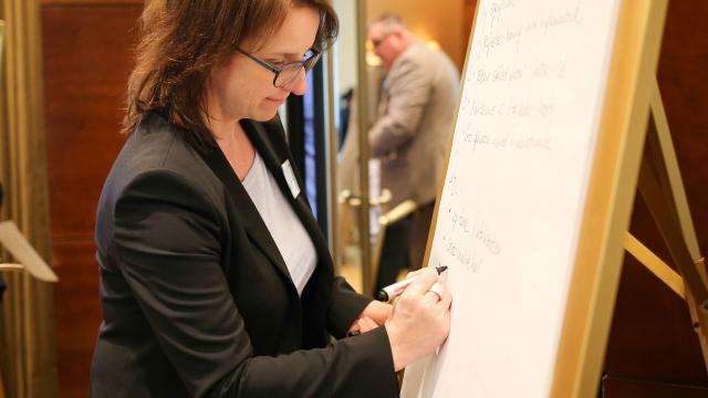 Woman at a whiteboard